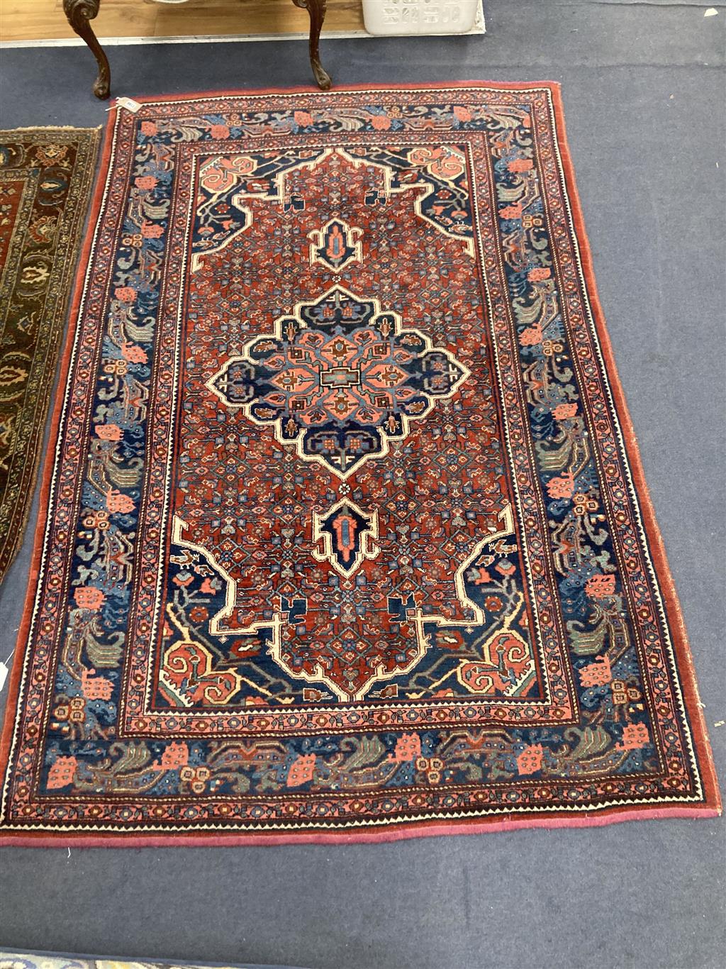 A red ground Shiraz rug, 204 x 132cm